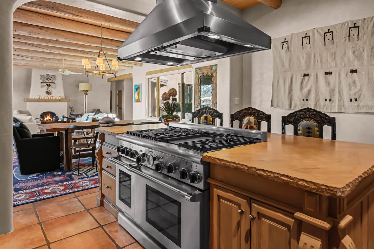 Chef's kitchen with a Thermador range and wood cabinetry